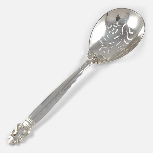 the Georg Jensen silver berry spoon viewed diagonally