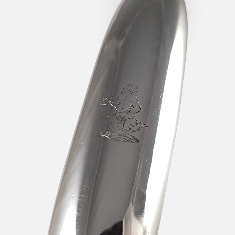 focused on the crested armorial engraving