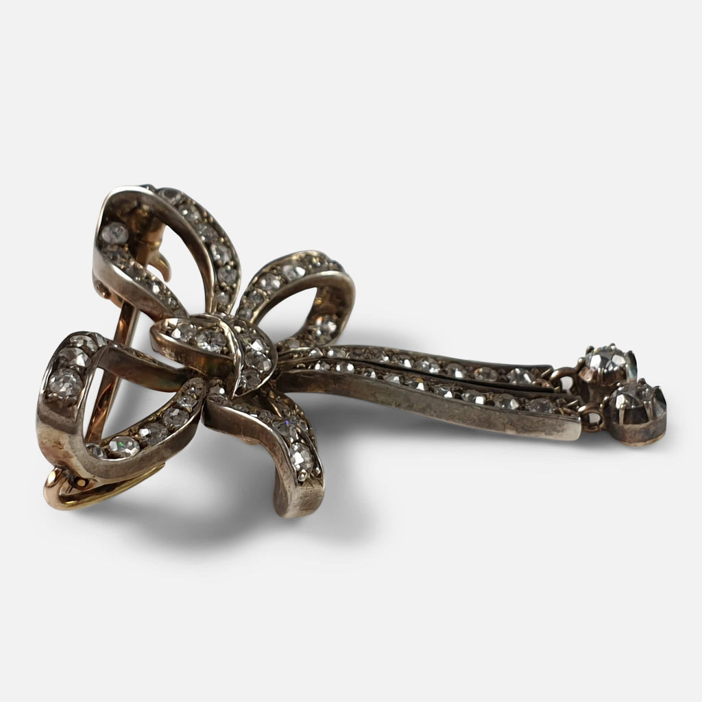 Silver discount bow brooch
