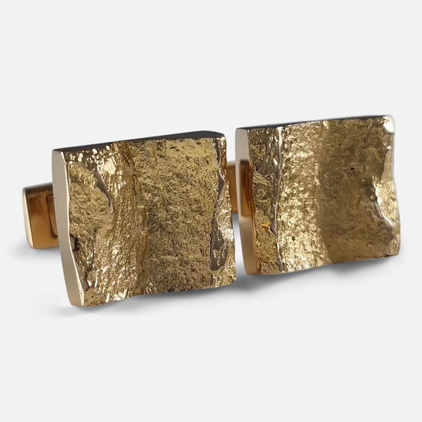 The 14ct Yellow Gold 'Ravines' Cufflinks by Björn Weckström for Lapponia, viewed at a slight angle