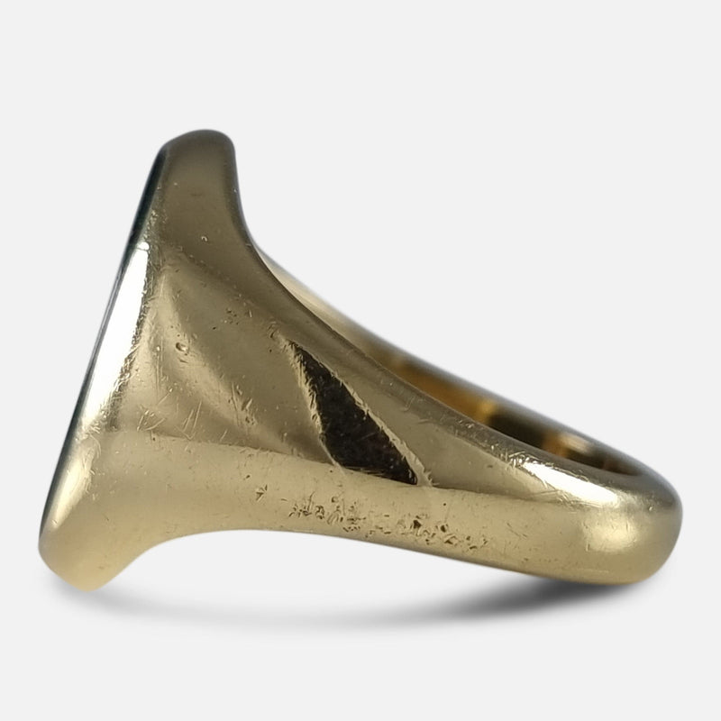 a side on view of the gold ring