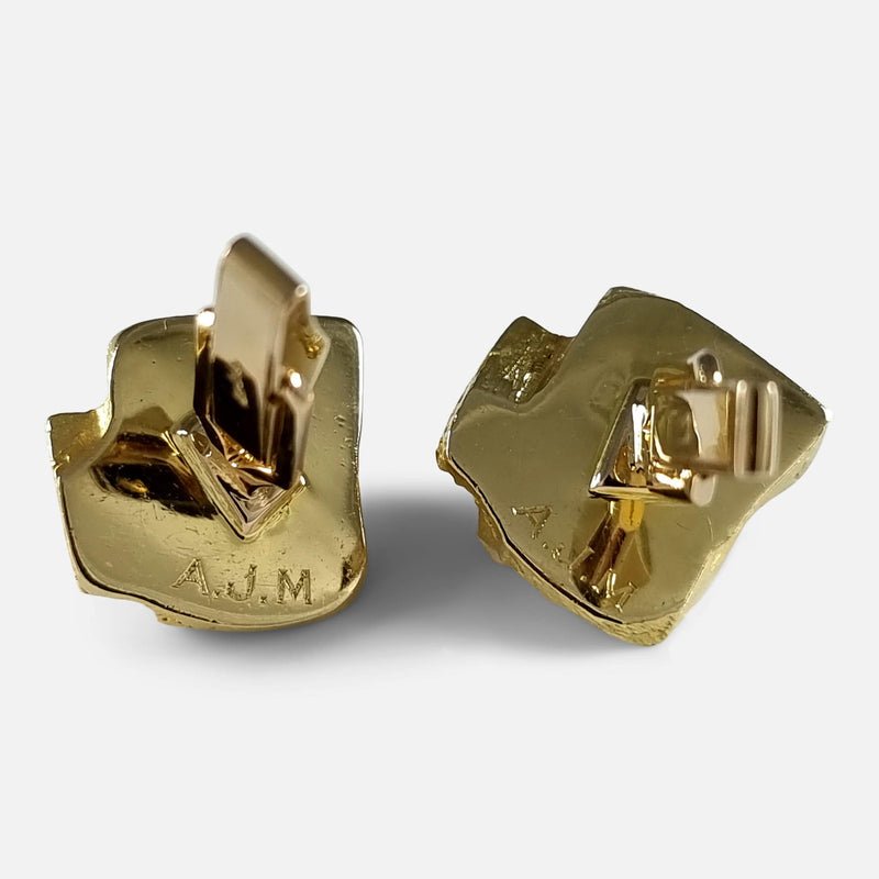 the back of the cufflinks with engraved initials
