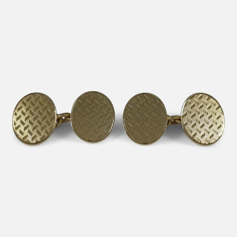the pair of the cufflinks viewed side by side tilted back slightly