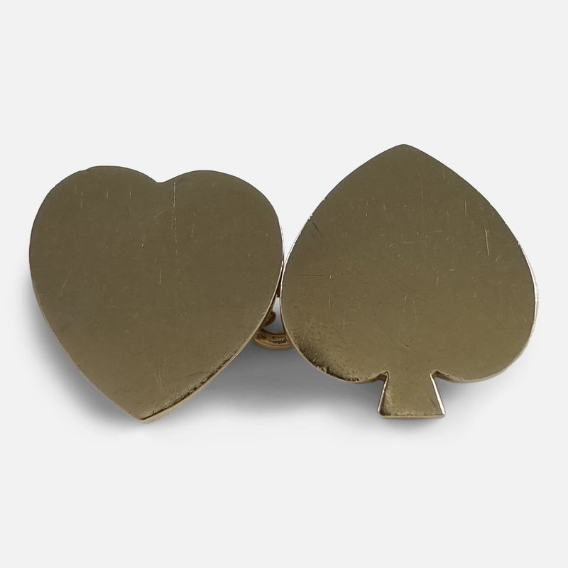 focused on the heart and spade cufflinks