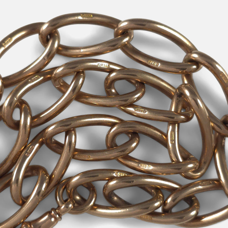 a number of chain links with partial hallmarks in focus