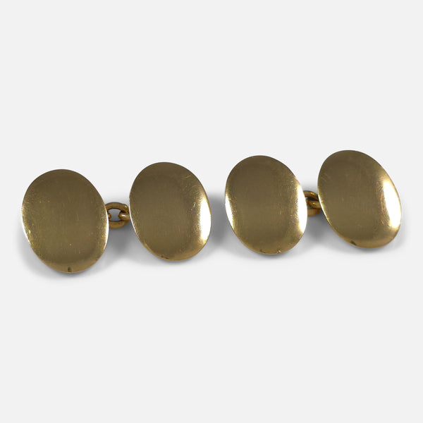 The Edwardian 18ct Yellow Gold Oval Cufflinks, viewed at a slight angle