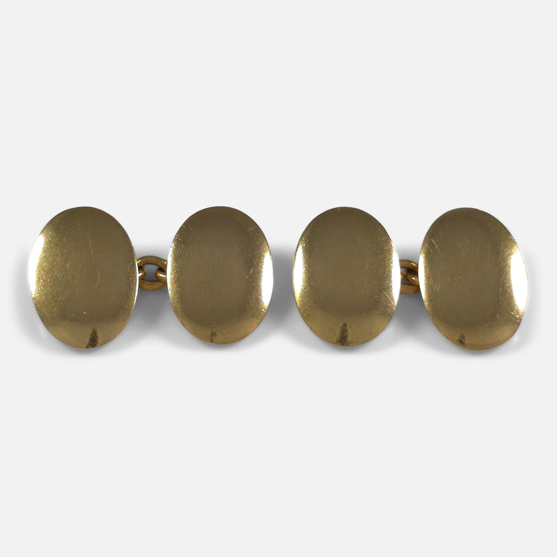 a birds eye view of the gold cufflinks