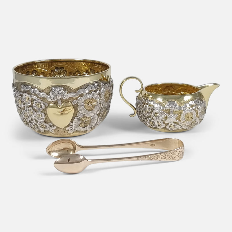 the silver gilt sugar and cream set viewed laid together