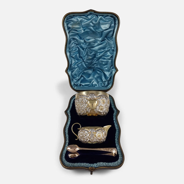 The Edwardian Sterling Silver-Gilt Sugar and Cream Set viewed in their case