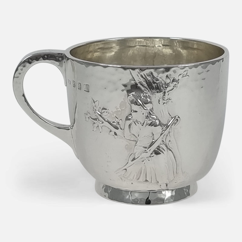 The Edwardian Sterling Silver Mug side on with chased scene of a maiden with a shepherd's crook, resting against a tree, to the forefront