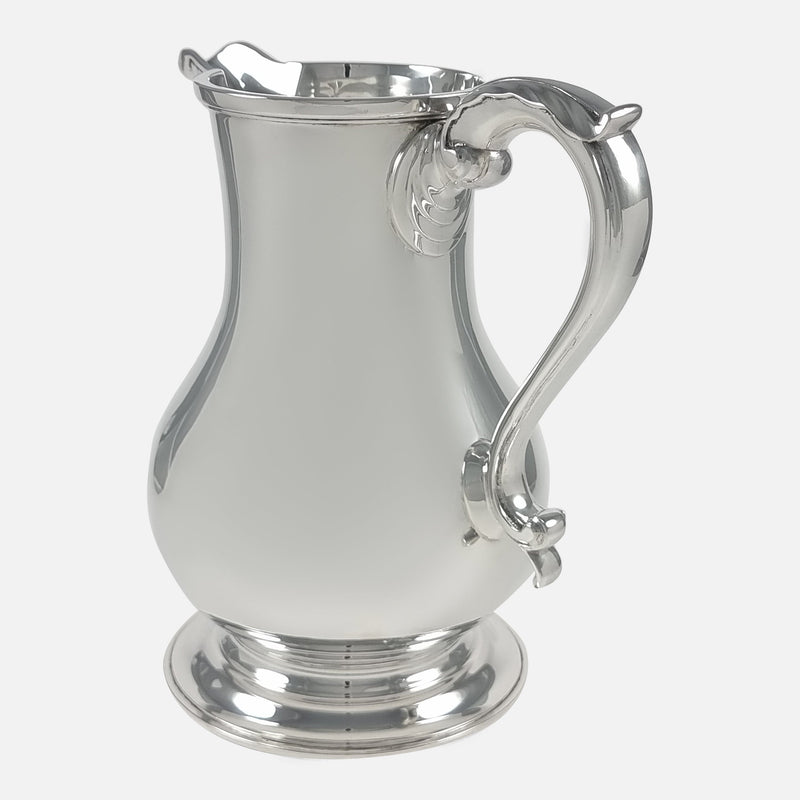 the jug rotated with spout facing backwards slightly towards the left