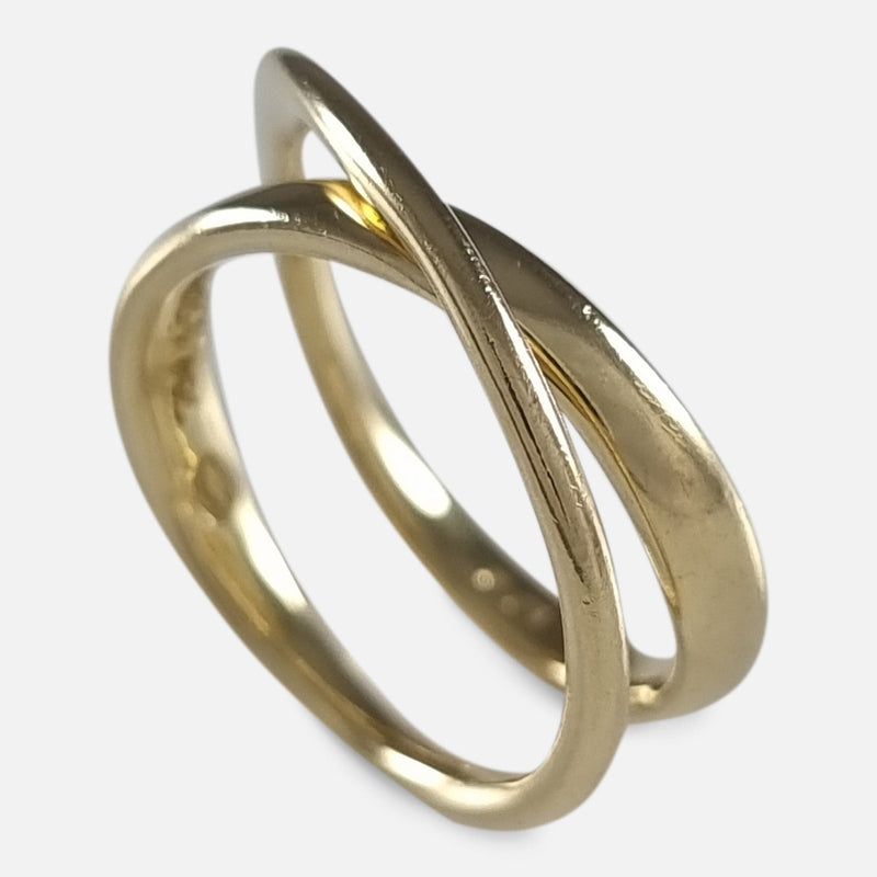 The Georg Jensen 18ct Gold Möbius Ring designed by Vivianna Torun, viewed from above at an angle