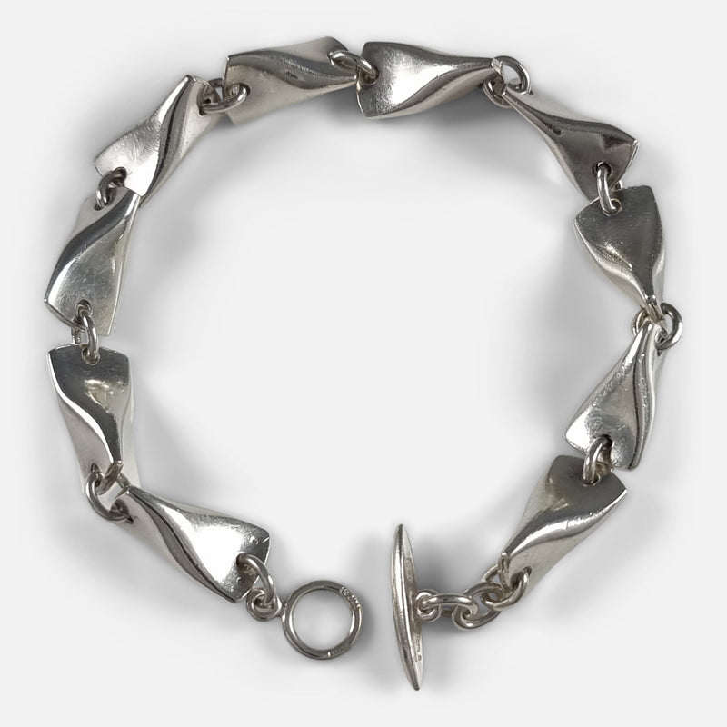 The Georg Jensen Sterling Silver Butterfly Bracelet #104A designed by Edvard Kindt-Larsen, viewed from above when unfastened
