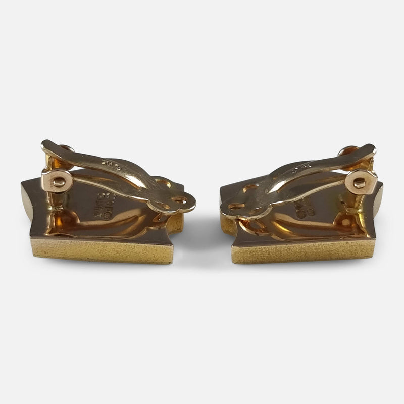 a side on view of the clip on earrings