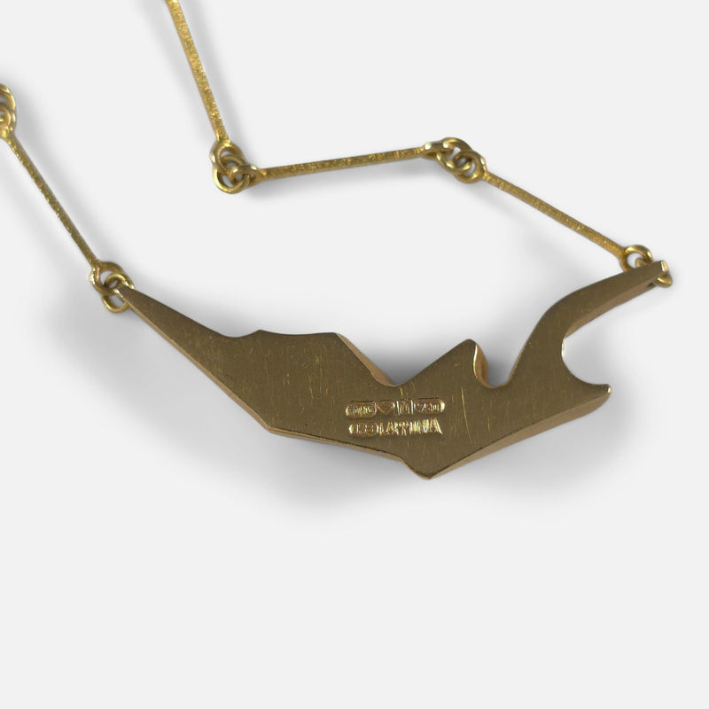 focused on the pendant face down to view the reverse