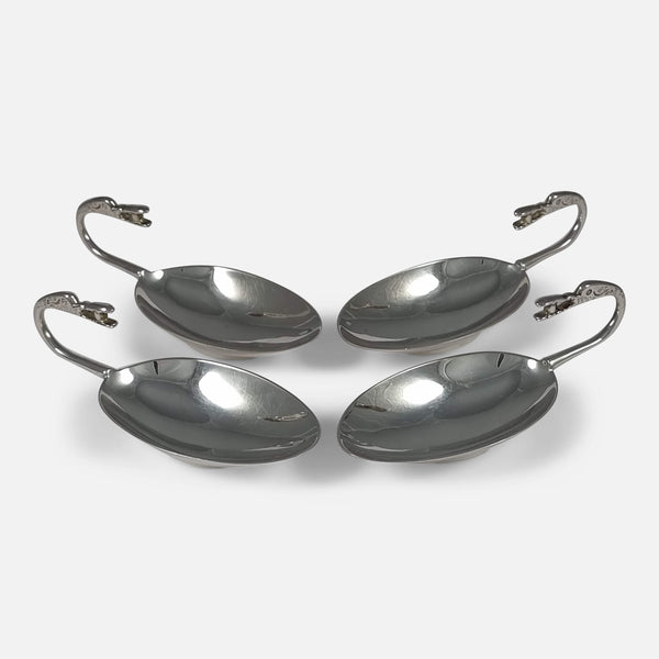 The Set of 4 Sterling Silver Traprain Dishes or Tastevins by Brook & Son, angled in to face towards each other