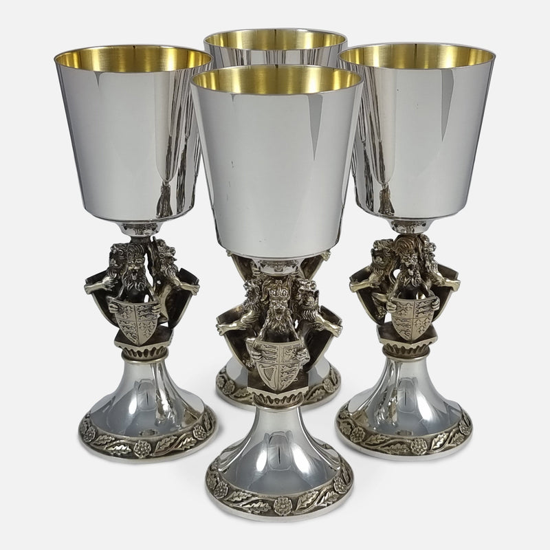 The Set of Four Aurum Silver Gilt 'College of Arms' Goblets by Hector Miller, in diamond formation