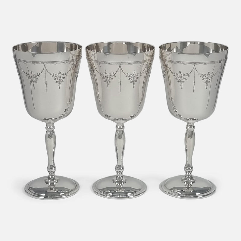 Close-up view focusing on three goblets side by side, highlighting their details and craftsmanship.