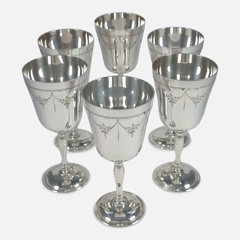 High-angle view of six goblets, displaying their design and spacing clearly.