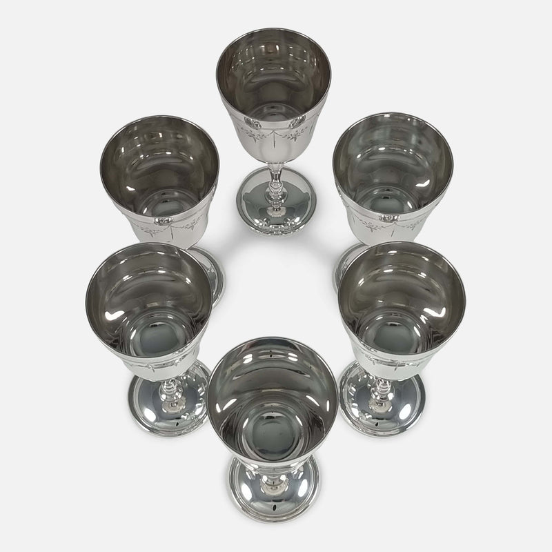 Directly above bird's-eye view of six goblets, showcasing their precise arrangement and details from a close overhead position.