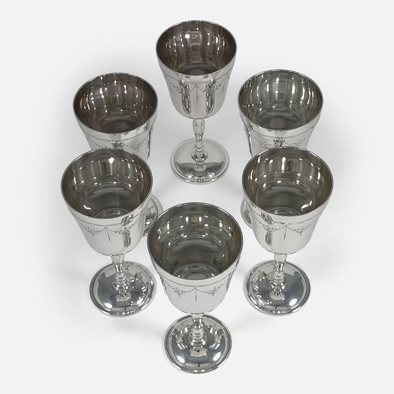 Bird's-eye view of six goblets, offering a comprehensive look at their arrangement from directly above.