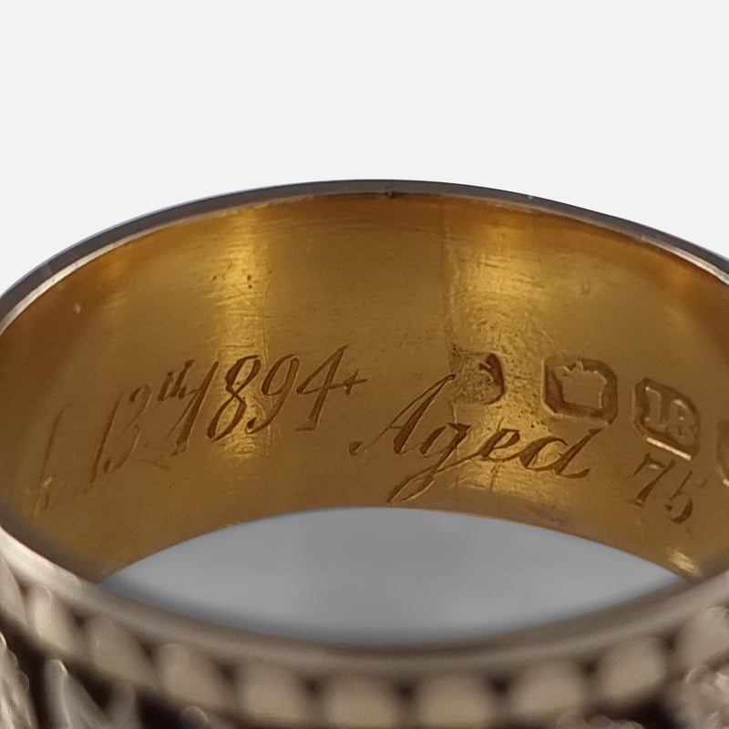 a section of the engraved inscription to the interior of the ring