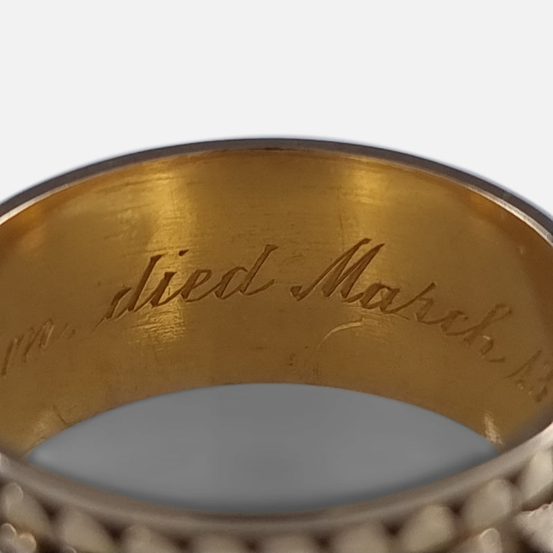 a section of the engraved inscription to the interior of the ring