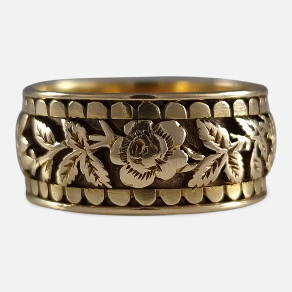 focused on a section of the foliate engraved decoration to the exterior of the ring