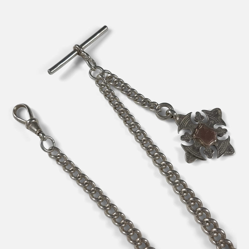 a section of the chain in focus to include dog clip, t-bar, and fob