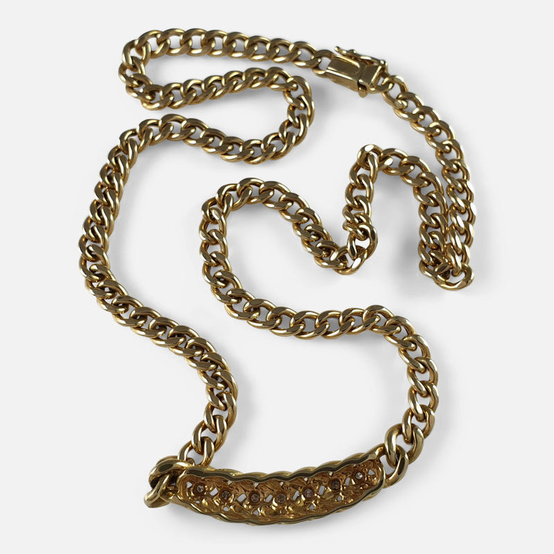 the gold necklace viewed from the back