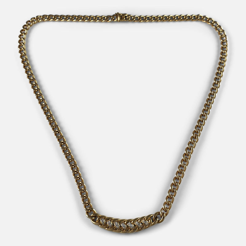 the gold curb chain necklace viewed from above