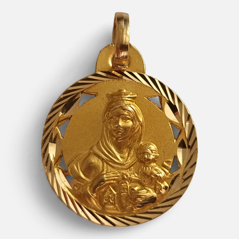 the 14ct yellow gold religious pendant depiction in relief of the Virgin Mary with Baby Jesus