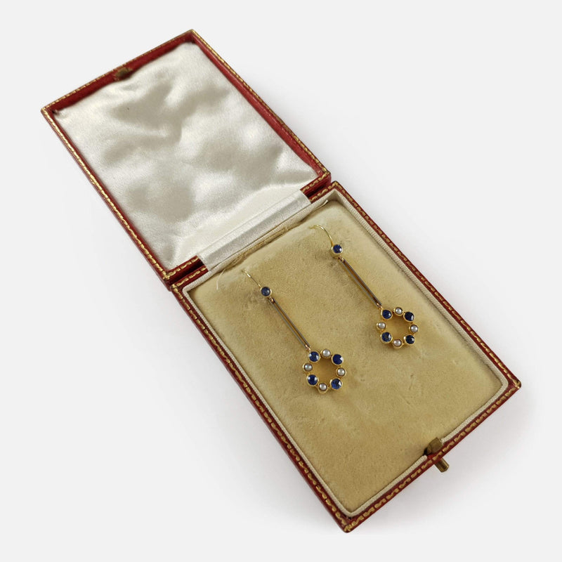 the earrings in their case viewed at an angle