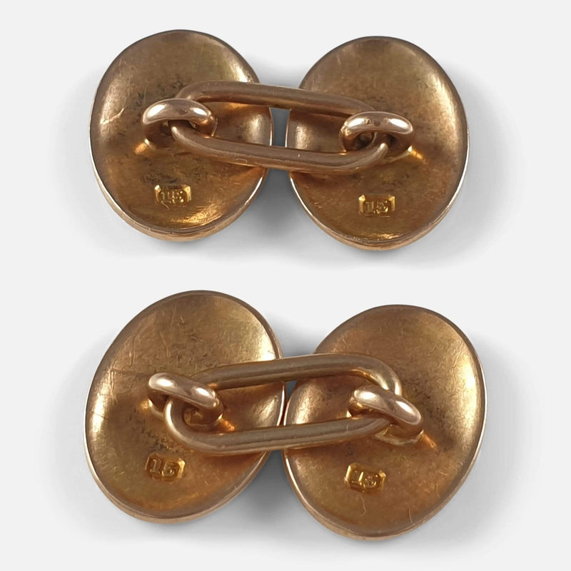 the pair of cufflinks lying face down to view the backs