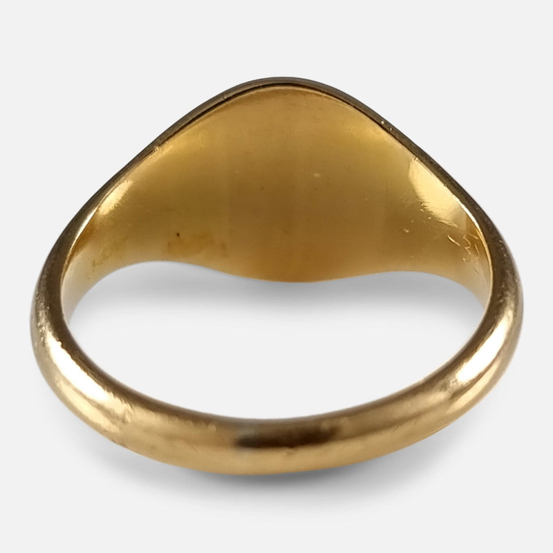 the back of the gold ring