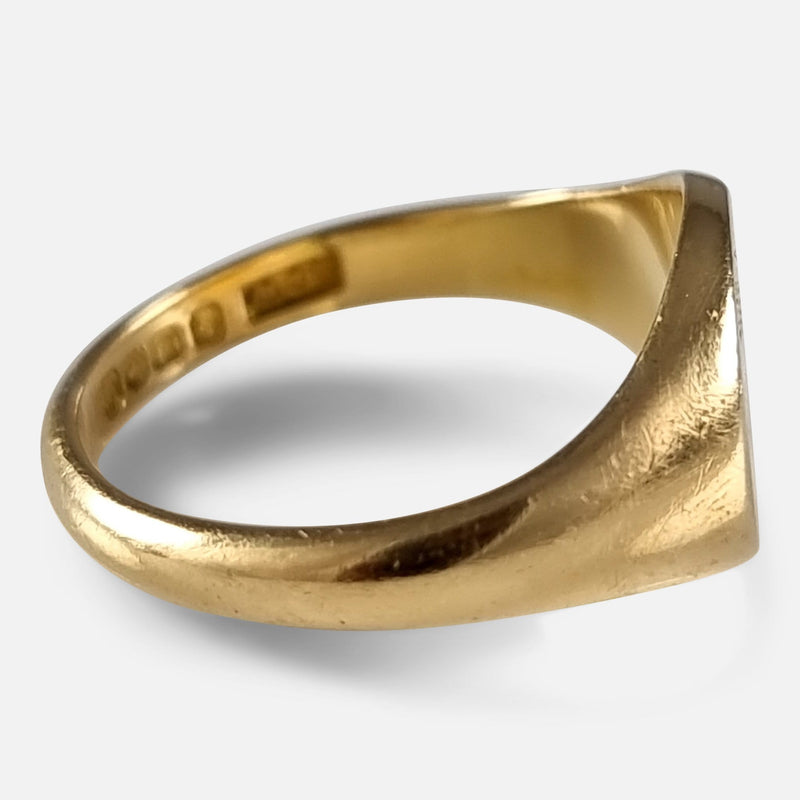 a side on view of the gold ring