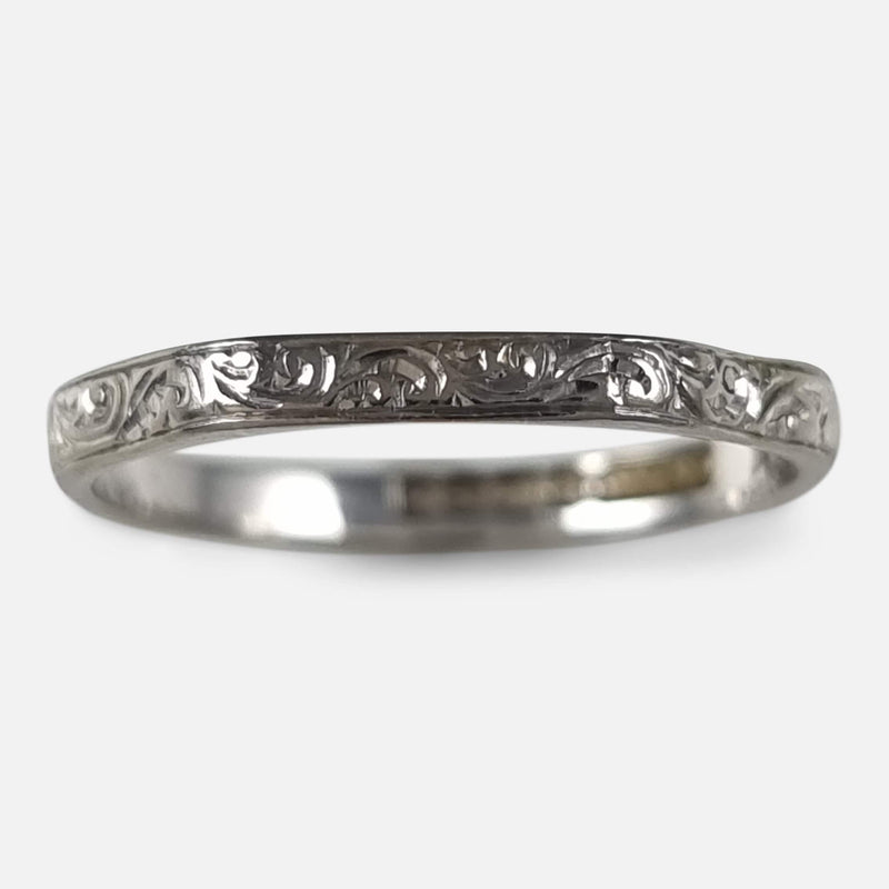 focused on the engraved detailing to the outside of the ring