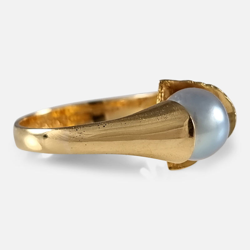 the gold ring viewed from the left side at a slight angle