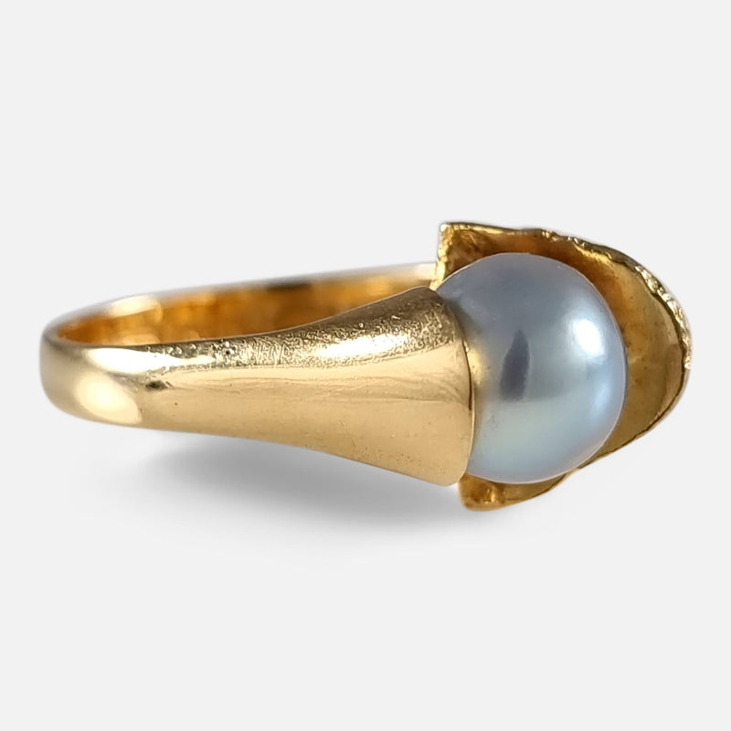 the gold ring viewed from the left side at a slight angle