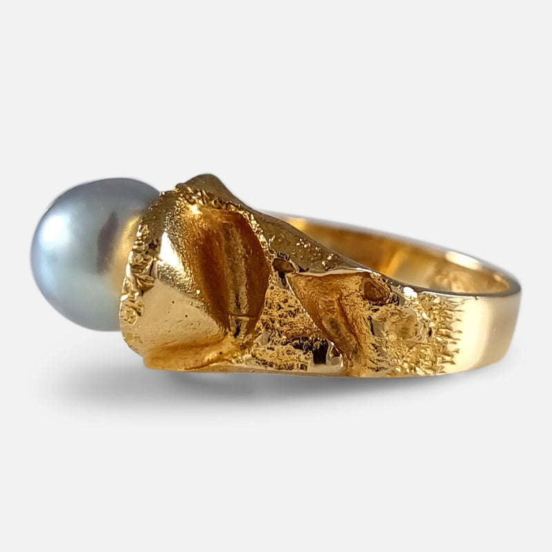 the gold ring viewed from the right side at a slight angle