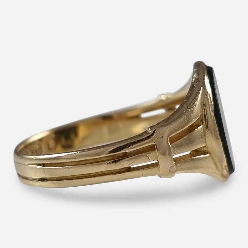 a side on view of the gold ring