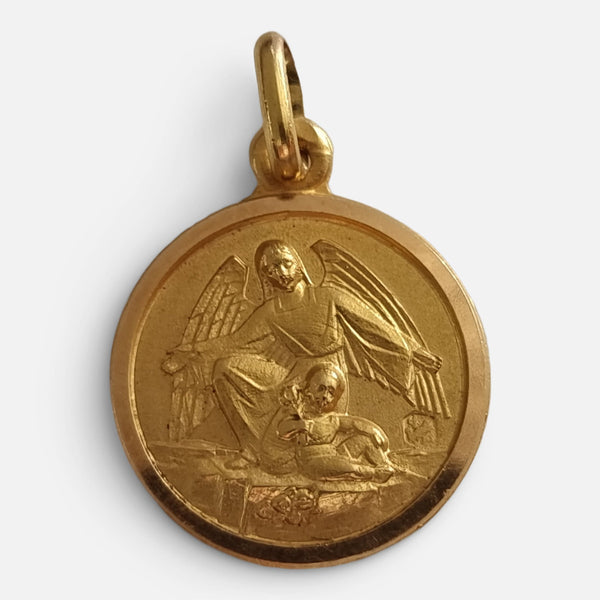 the 18ct yellow gold religious pendant depiction in relief of a child and guardian angel