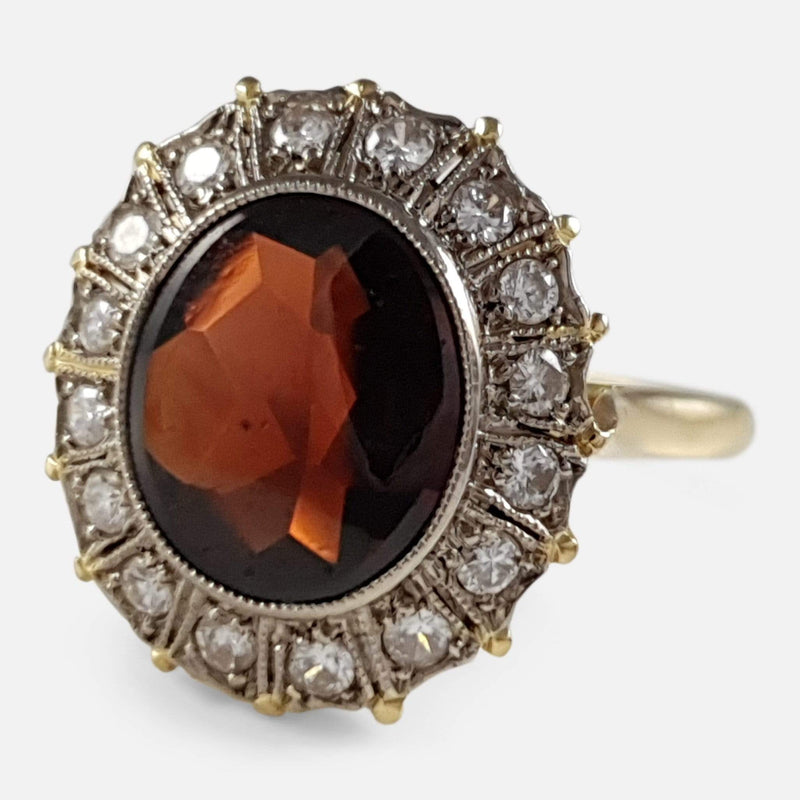 the 18ct yellow gold garnet and diamond cluster ring viewed from the right