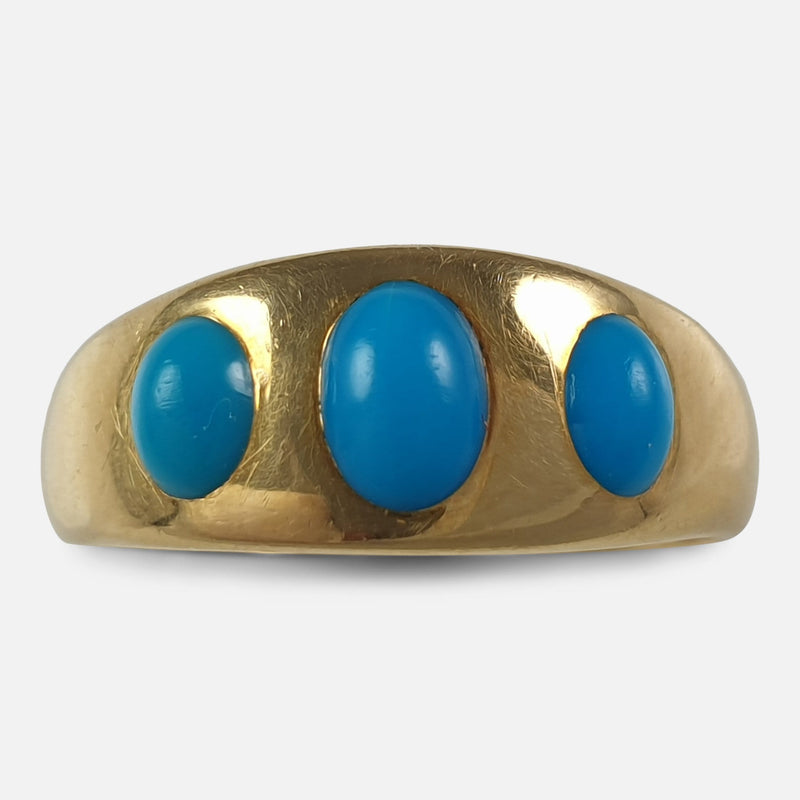 the Edwardian 18ct yellow gold and turquoise cabochon gypsy ring viewed from the front