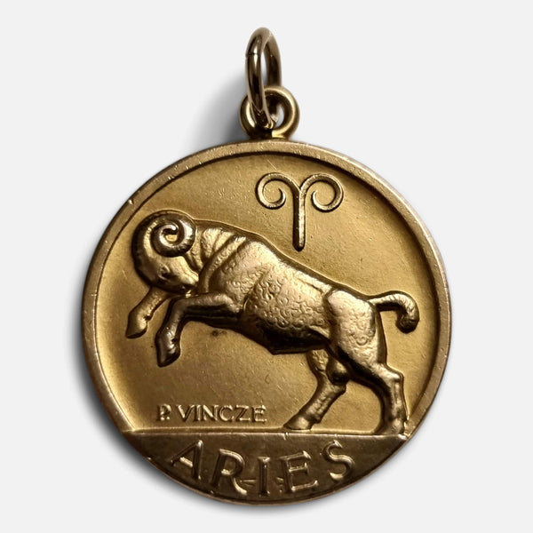 the 9ct gold Aries pendant by Paul Vincze, viewed from the front