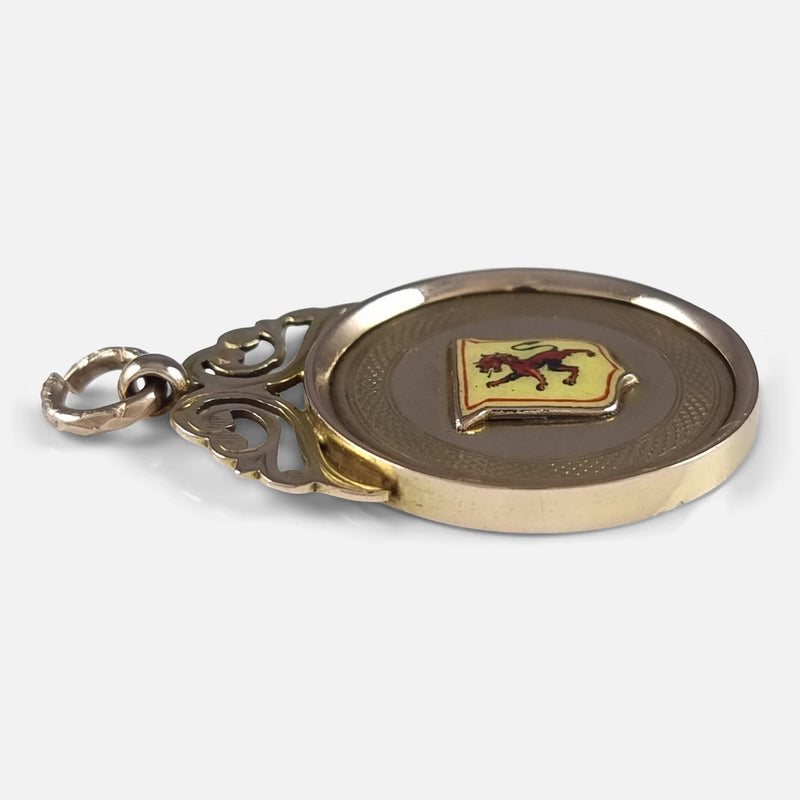 a side on view of the gold fob