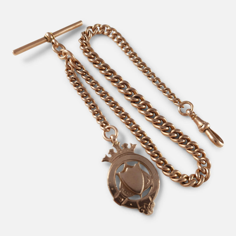 the 9ct rose gold albert watch chain and medal viewed diagonally
