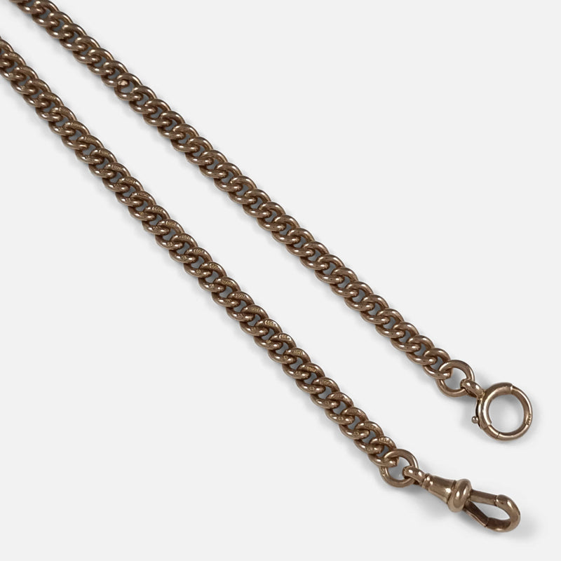 a section of the chain in focus to include the T-bar and roll pin clasp