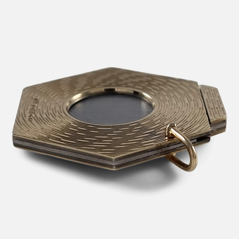 a side on view of the gold cigar cutter