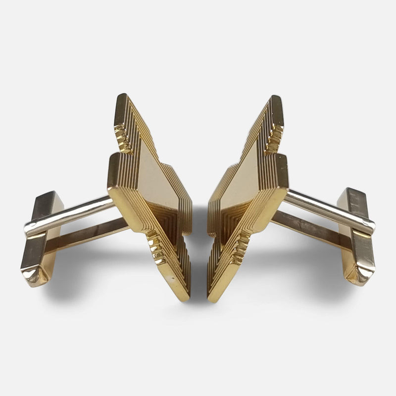 a side on view of the cufflinks positioned to face each other